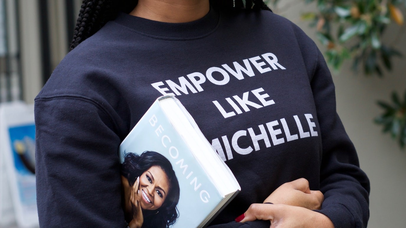 Woman carrying Michelle Obama's book