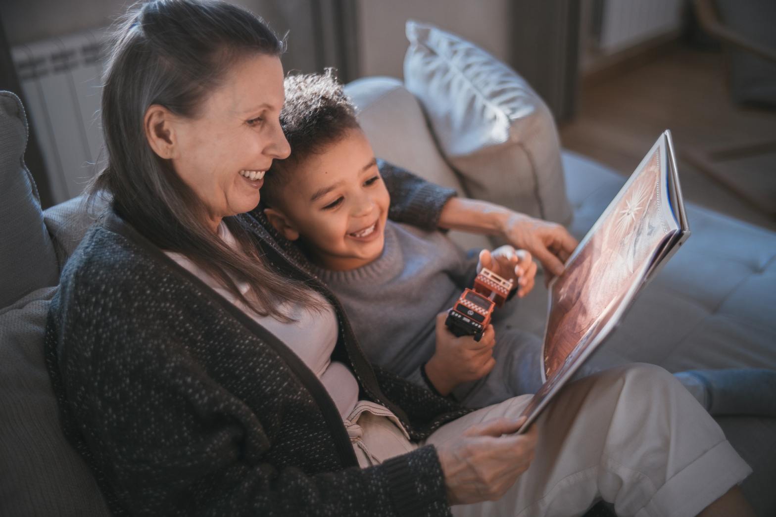 A mother and a kid reading a book